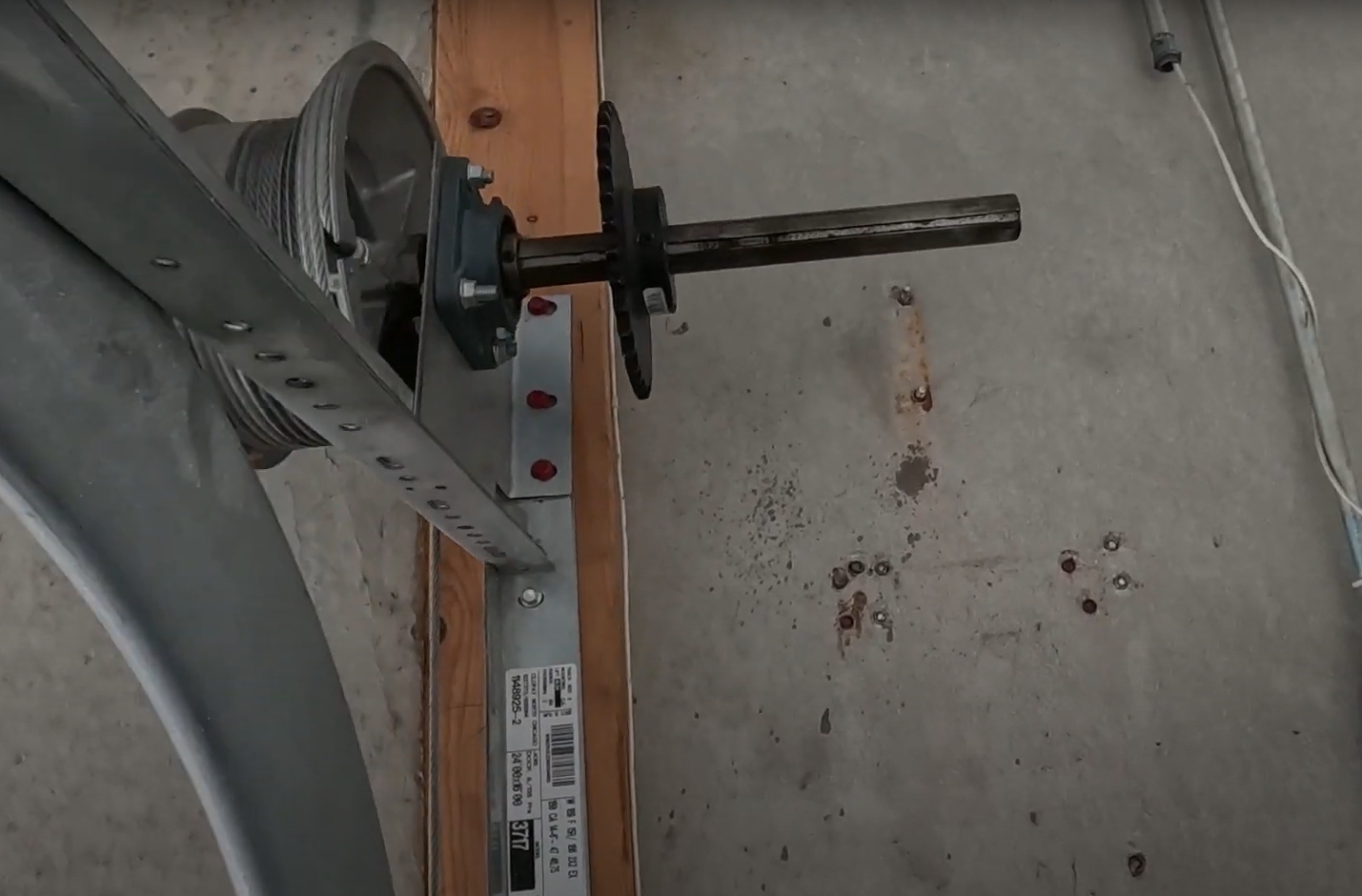 professional technician performing garage door track repair in Hilliard Ohio
