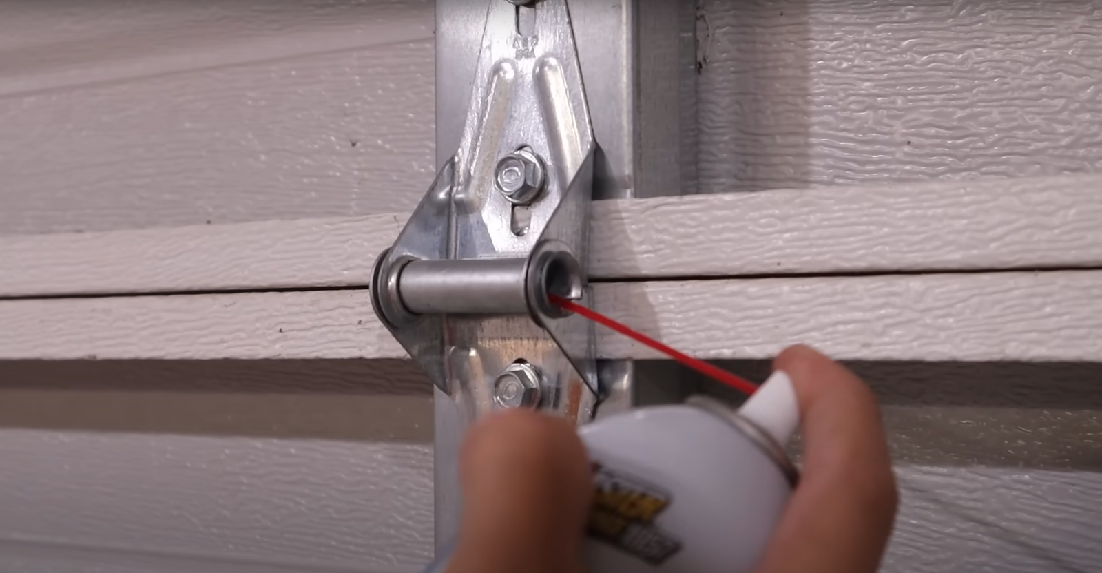 technician performing noisy garage door fix in Hilliard Ohio