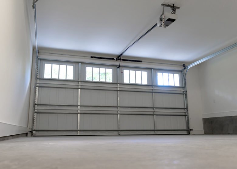 professional technician performing overhead garage door repair in Hilliard Columbus Ohio