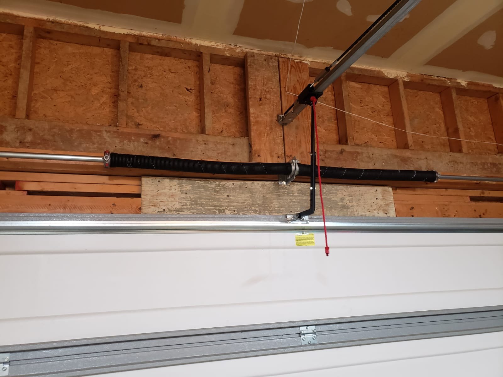 Garage door spring repair maintenance to improve performance and longevity.